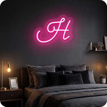 Pink custom neon letter H mounted above a bed in a modern bedroom