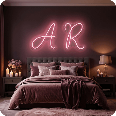 Pink custom neon letters AR in a bedroom with candles